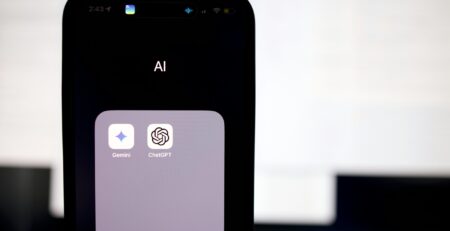 a close up of a cell phone with an ai button