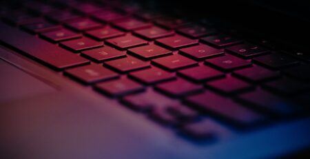 a-close-up-of-a-keyboard-with-a-blurry-background